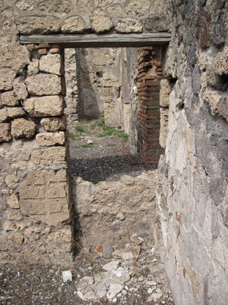 I.3.8b Pompeii. September 2010. North wall of cubiculum, showing reverse of blocked doorway or window aperture. Note difference in height of aperture. Photo courtesy of Drew Baker.