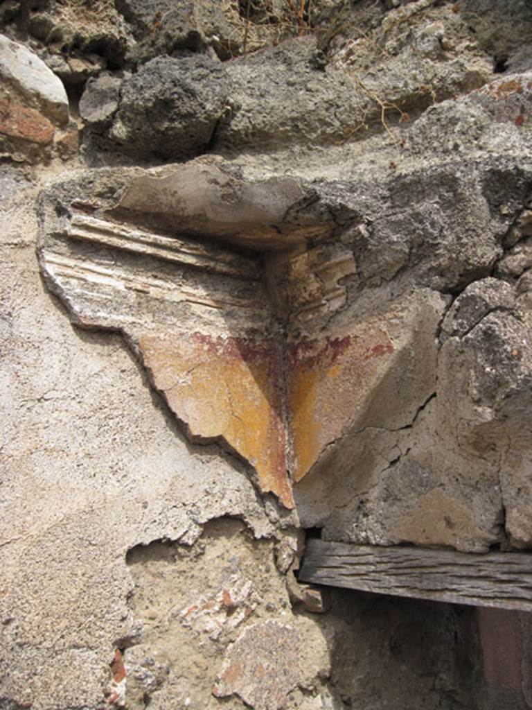 I.3.8b Pompeii. September 2010. North-east corner above doorway showing detail of plaster work. Photo courtesy of Drew Baker.