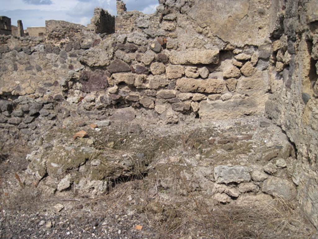 I.3.8a Pompeii. September 2010. Looking towards north wall of kitchen or room in north-east corner, with hearth or raised feature? Photo courtesy of Drew Baker.