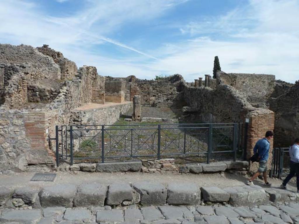 I.3.10 Pompeii, on left. September 2015. Two linked doorways on east side of Via Stabiana. I.3.9 shop, on right.