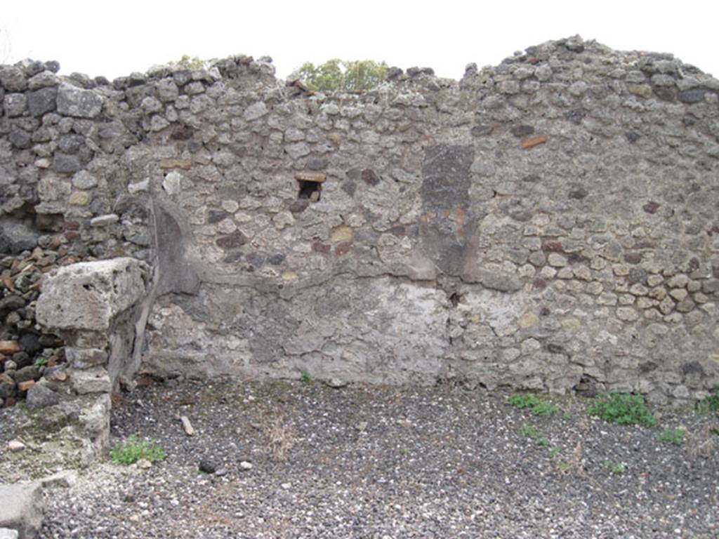 I.3.10 Pompeii. September 2010. South wall of entrance room and south-east corner, (part of I.3.9). On the left, the doorway to the first rear room can be seen. Photo courtesy of Drew Baker.