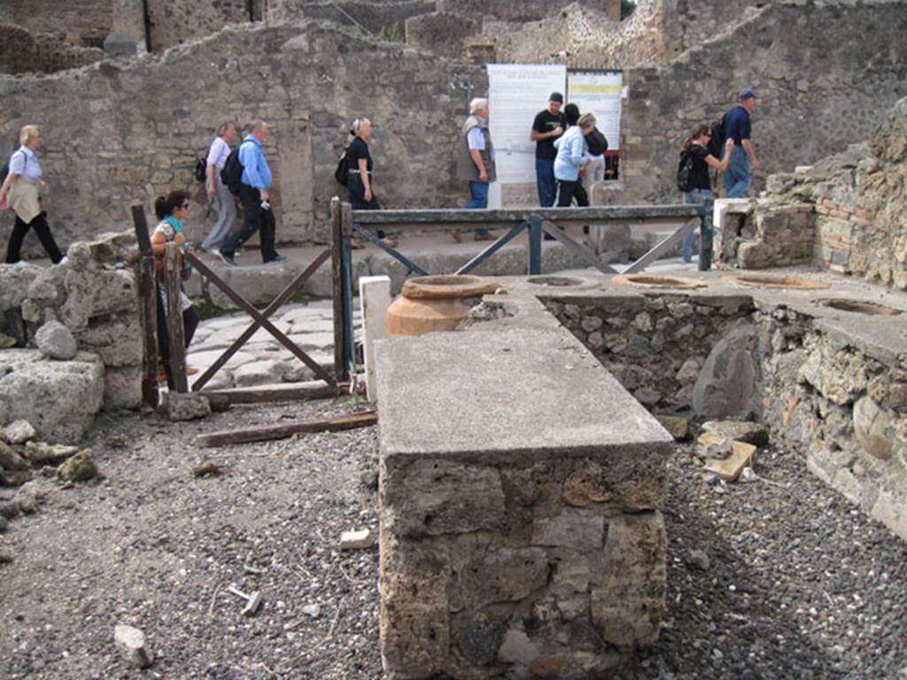 I.3.11 Pompeii. September 2010. Looking west across bar-room towards Via Stabiana.
Photo courtesy of Drew Baker.