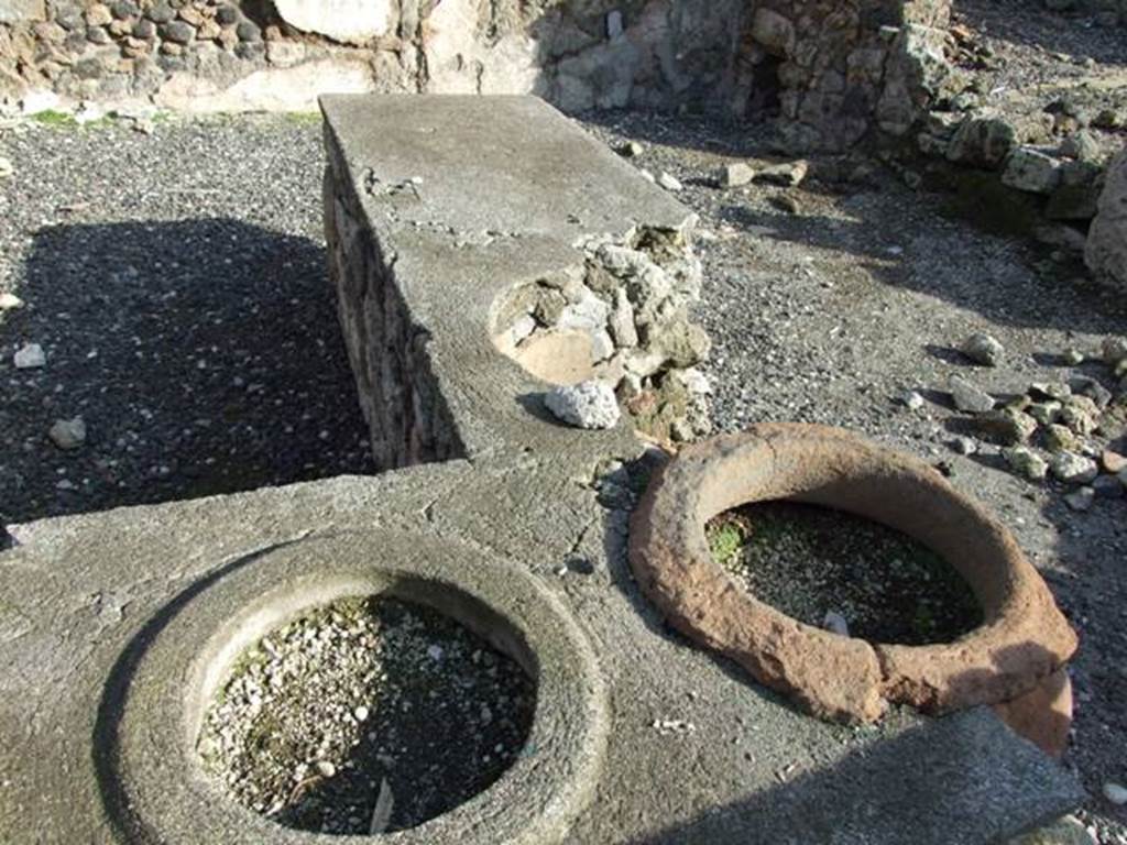 I.3.11 Pompeii. December 2007. Counter with the remaining three of the eight dolia.