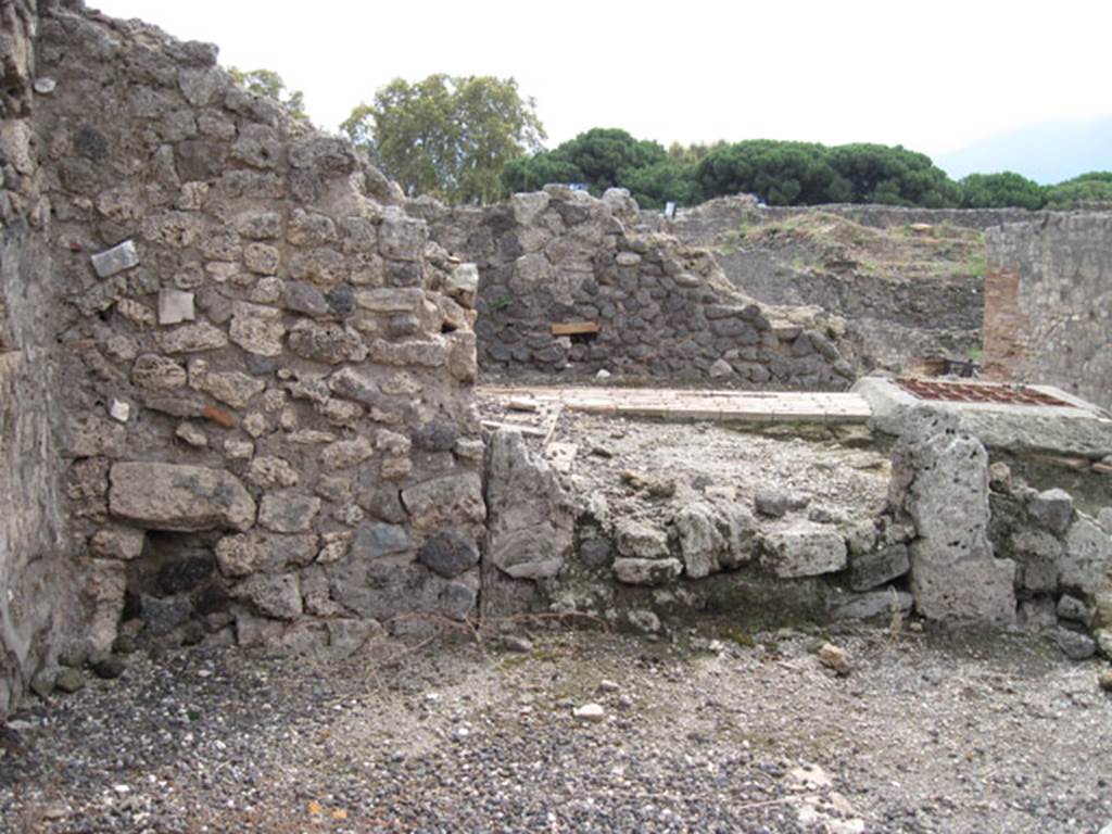 I.3.11 Pompeii. September 2010. Looking towards south wall, note feature in centre of image which resembles blocked up doorway, beyond is the Sarno Canal route.
Photo courtesy of Drew Baker. The blocked up doorway would have led into the side room, described by Fiorelli as “being for the use of the customers”.