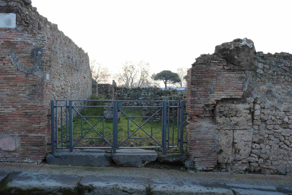 I.3.13 Pompeii. December 2018. Looking south to entrance doorway in Vicolo del Menandro. Photo courtesy of Aude Durand.
