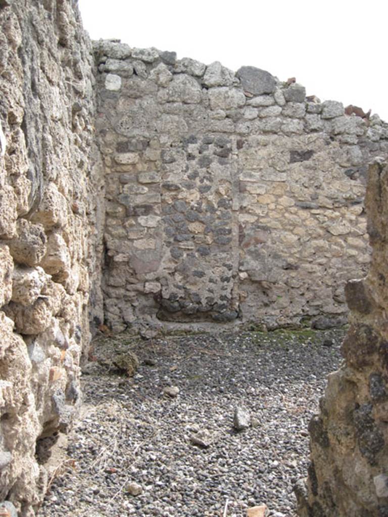 I.3.19 Pompeii. September 2010. Looking south from entrance doorway of steps to upper floor. Ahead can be seen the blocked doorway in the south wall of I.3.18. Photo courtesy of Drew Baker.