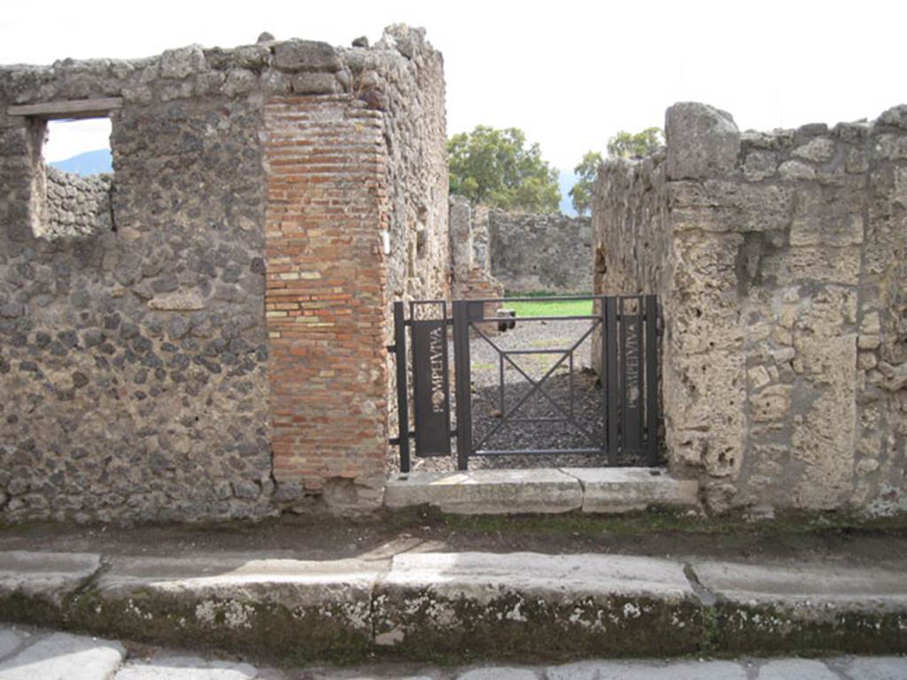 I.3.20 Pompeii. September 2010. Looking south across Vicolo del Menandro towards entrance doorway. Photo courtesy of Drew Baker.