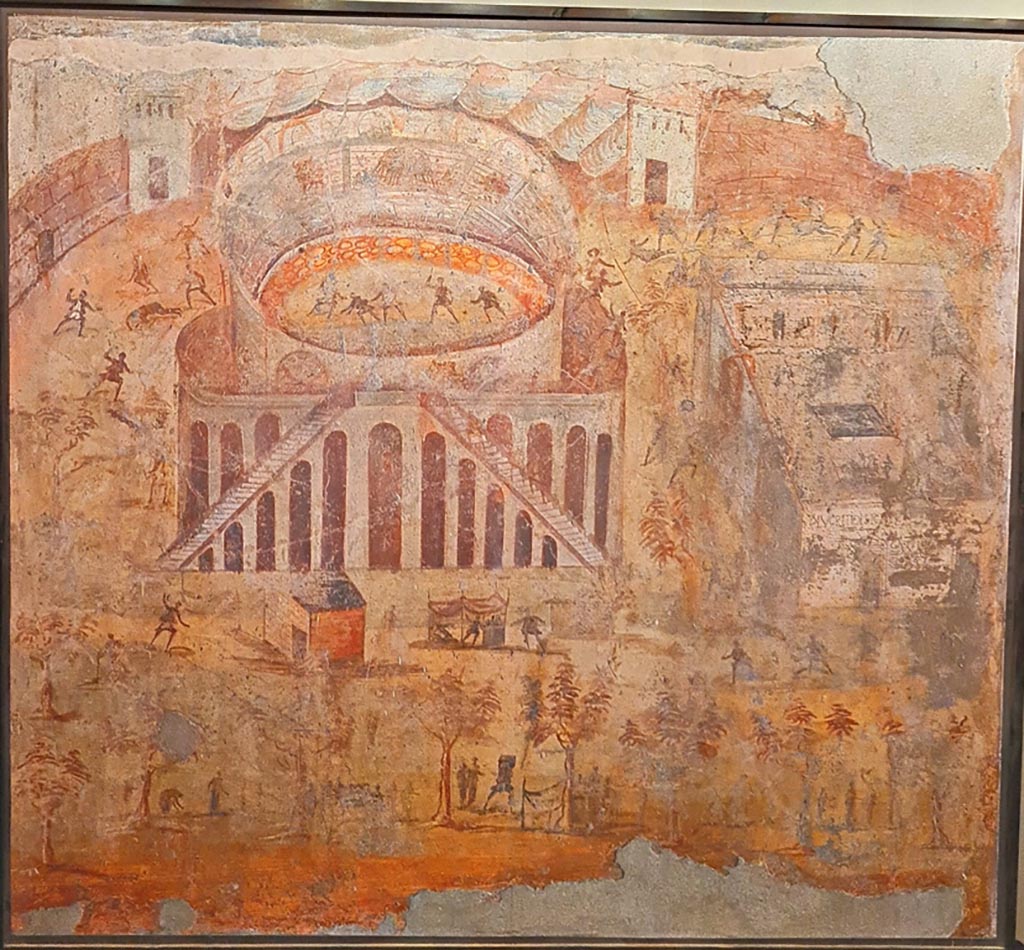 I.3.23 Pompeii. Photo taken May 2021, courtesy of Giuseppe Ciaramella. Rear wall of the peristyle.
Painting of “Riot in the Amphitheatre” depicting the fight between the Nucerians and the Pompeians.
Now in Naples Archaeological Museum. Inventory number 112222.