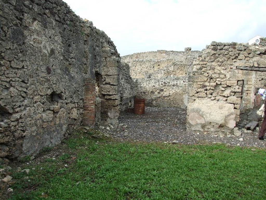 I.3.24 Area of peristyle, with large Triclinium overlooking it (centre of picture)