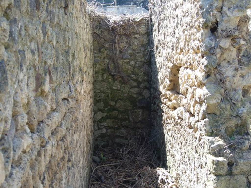 I.3.27 Pompeii. March 2009. Looking west at end of narrow corridor or steps to upper floor.
According to CTP, this narrow passageway would have had a doorway �blocked in antiquity� at its west end. See Van der Poel, H. B., 1986. Corpus Topographicum Pompeianum, Part IIIA. Austin: University of Texas. (p.6)

