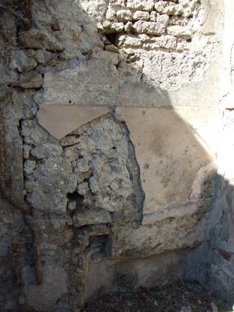 I.3.27 Pompeii. March 2009. Remains of plaster on north wall of small room, and recess in north-east corner.