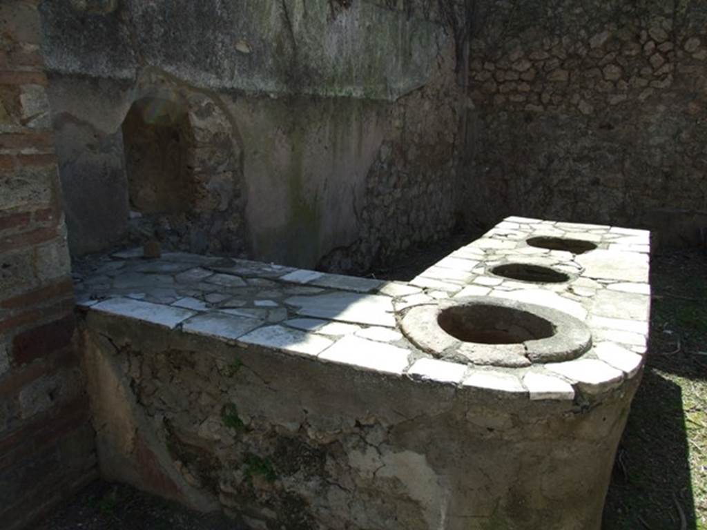 I.3.28 Pompeii. March 2009. Counter with three urns.