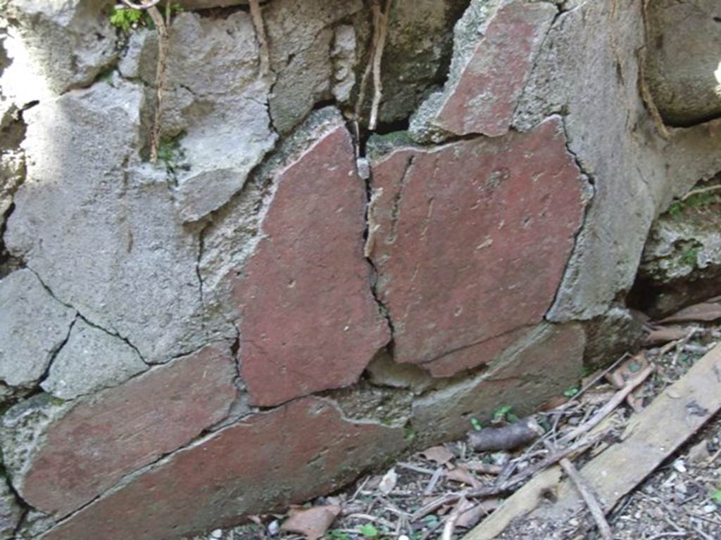 I.3.28 Pompeii. March 2009. Remains of painted plaster on interior north side of counter.
