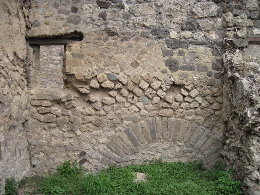 I.3.29 Pompeii. September 2010. East wall of room 2 in north-east corner of property, with window overlooking Vicolo del Citarista. Photo courtesy of Drew Baker.