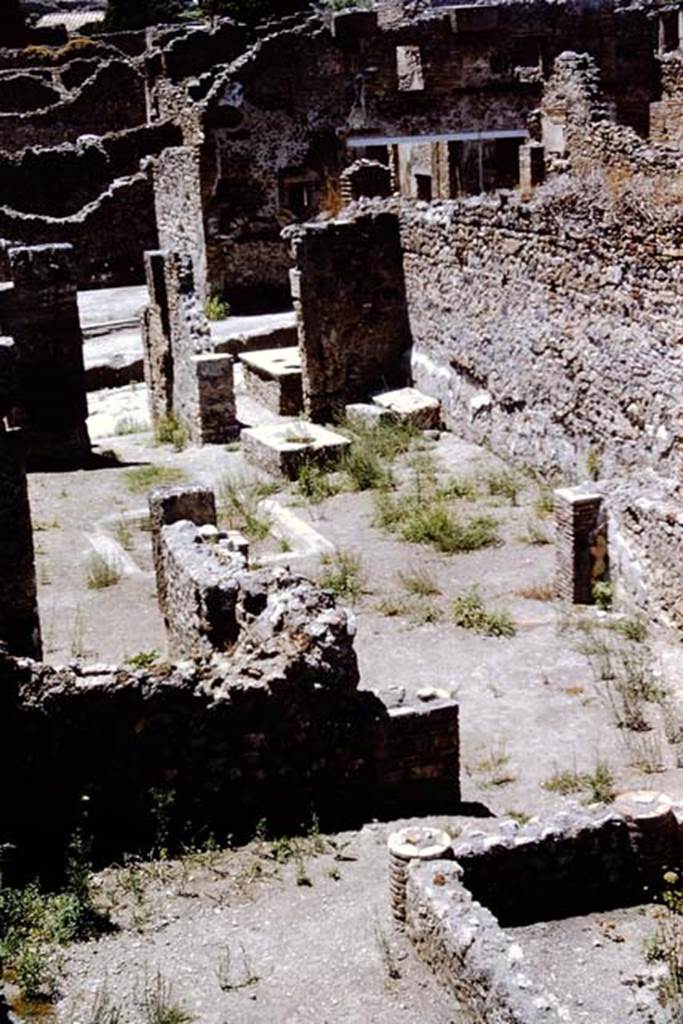 I.4.2 Pompeii. 1966. Looking from top of stairs across south portico to tablinum and atrium.
The doorway from I.4.3 can be seen on the north (right) side of the entrance doorway of I.4.2. Photo by Stanley A. Jashemski.
Source: The Wilhelmina and Stanley A. Jashemski archive in the University of Maryland Library, Special Collections (See collection page) and made available under the Creative Commons Attribution-Non Commercial License v.4. See Licence and use details.
J66f0151