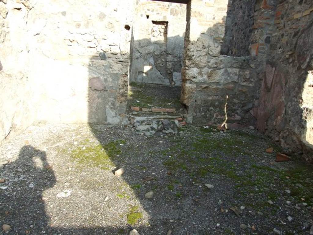 I.4.4 Pompeii. December 2007. Looking east across floor of shop, and threshold/step to rear room.