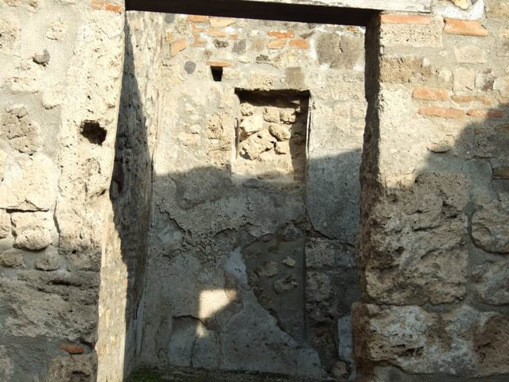 I.4.4 Pompeii. December 2007. Doorway into rear room that contained a small hearth and staircase to upper floor. See Eschebach, L., 1993. Gebäudeverzeichnis und Stadtplan der antiken Stadt Pompeji. Köln: Böhlau. (p.26).