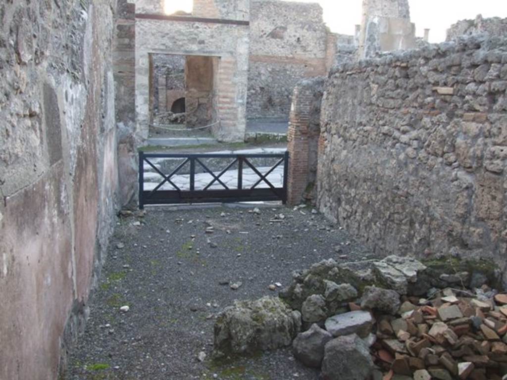 I.4.6 Pompeii. December 2007. Looking west towards entrance across remains of wall separating rear room from shop.