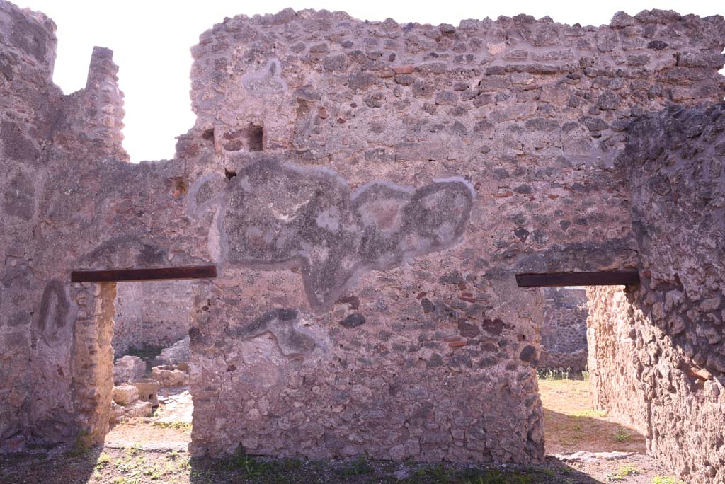 I.4.17 Pompeii. October 2019.
Looking towards south wall of shop-room, with doorway to I.4.12, on left, and door to I.4.13, on right.
The doorway on the left leads into room h of I.4.12 and can be seen on the page for that number.
The doorway on the right leads into room b of I.4.13 and can be seen on that number.
Foto Tobias Busen, ERC Grant 681269 DÉCOR.