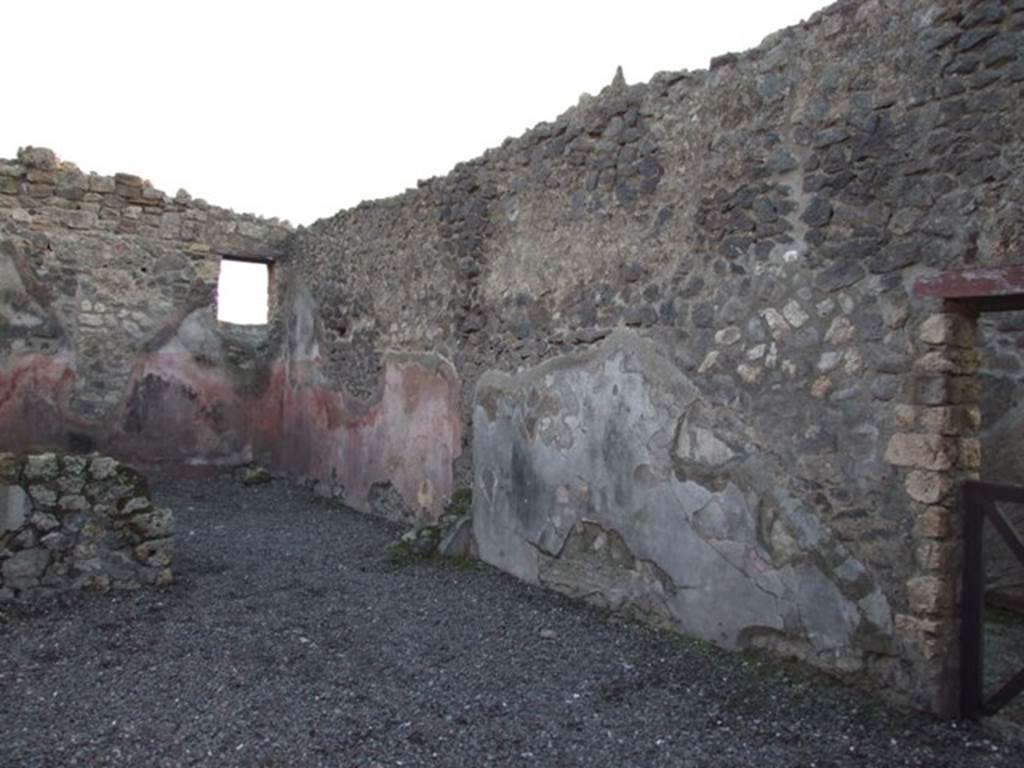 I.4.23 Pompeii. December 2007. Looking south-west. The window in the rear room overlooks the atrium of I.4.22. The doorway in the west wall has access to the fauces of I.4.22.