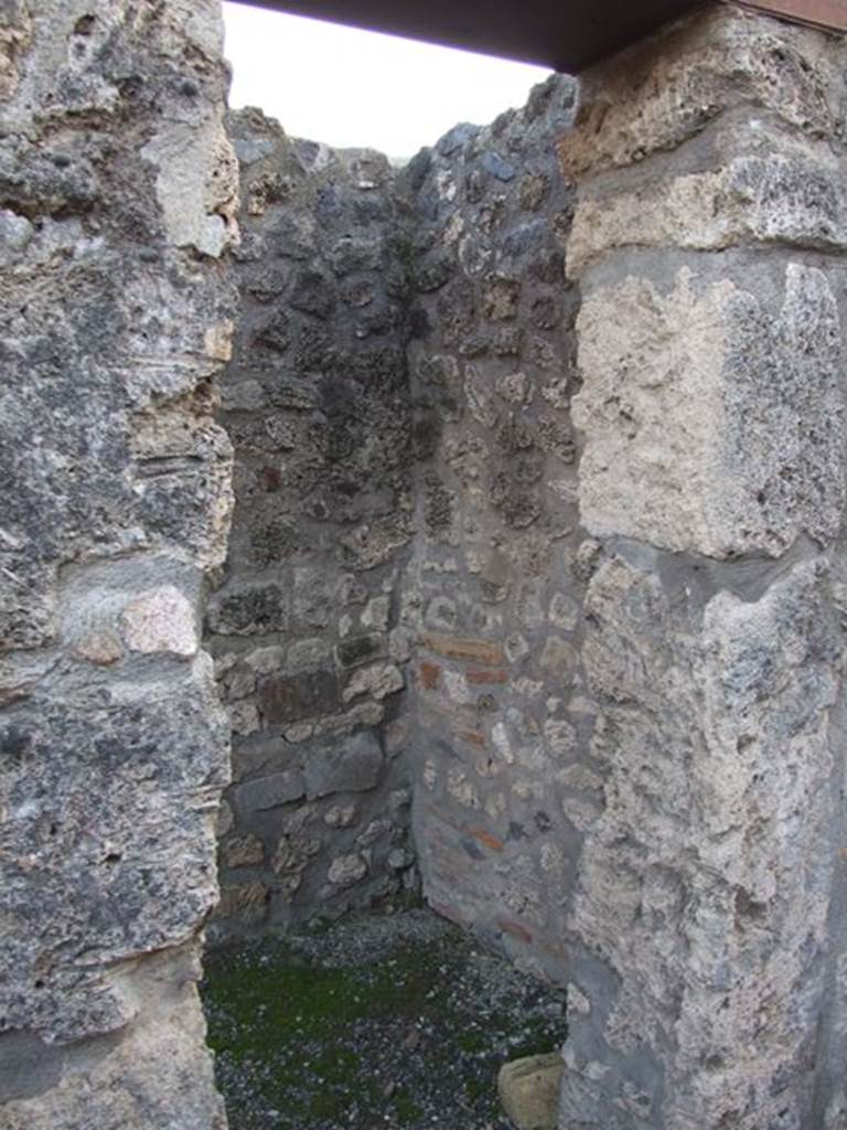 I.4.25 Pompeii. December 2007.
Doorway to room 5, looking south into small room or ostiarius with two doorways.
Photograph is taken from the fauces. The other door is in the west wall of the atrium.