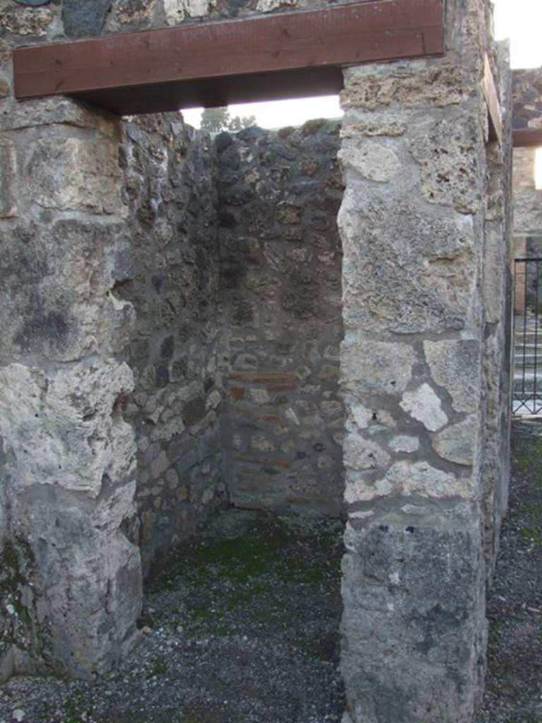 I.4.25 Pompeii. December 2007.
Doorway to room 5, looking west into small room or ostiarius with two doorways.
Photograph is taken from the atrium, and the other door is in the south wall of the fauces/entrance corridor.