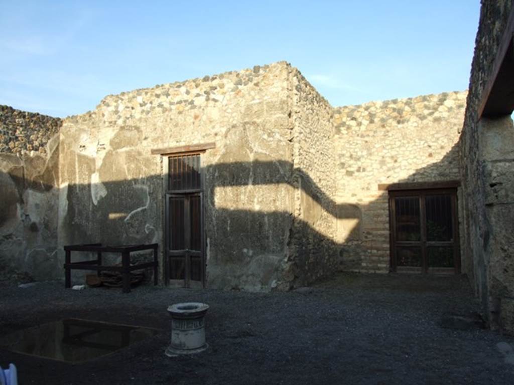 I.4.25 Pompeii. December 2007.
Room 47, atrium. Looking east to doorway to room 53 on left, east ala 54, and doorway to room 55, on right.