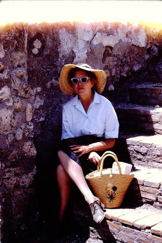 I.4.25 Pompeii. 1966. Wilhelmina resting in the shade on the stairs between peristyles.
Photo by Stanley A. Jashemski.
Source: The Wilhelmina and Stanley A. Jashemski archive in the University of Maryland Library, Special Collections (See collection page) and made available under the Creative Commons Attribution-Non Commercial License v.4. See Licence and use details.
J66f0558