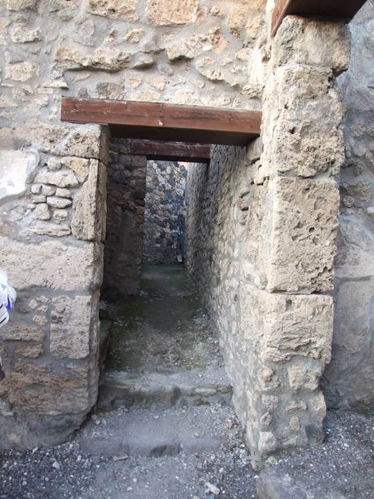 I.4.25/I.4.5 Pompeii. December 2007.
Doorway to corridor on north side of atrium of I.4.5, leading to kitchen and baths area.