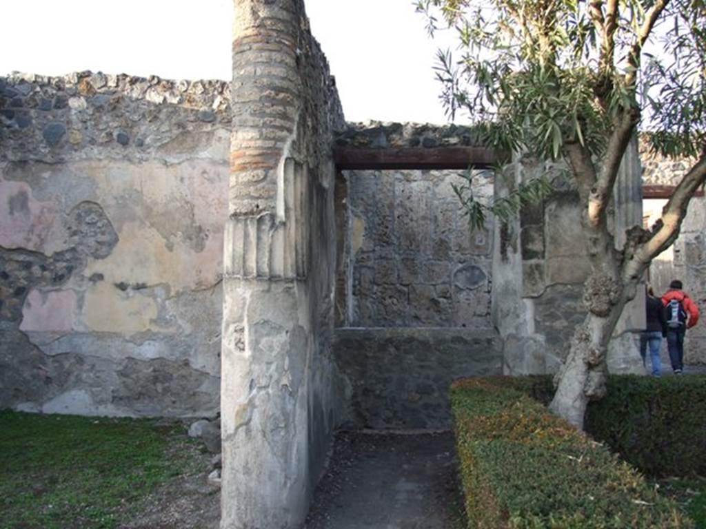 I.4.25 Pompeii. December 2007.
Looking north in north-west corner of upper peristyle 56, with window from ambulatory on east side of doorway from room 52, in centre.