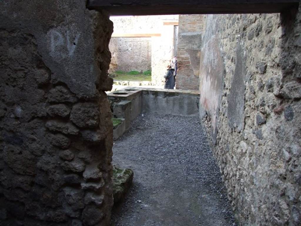 I.4.27 Pompeii. December 2007. Looking north from rear room to counter and entrance.
