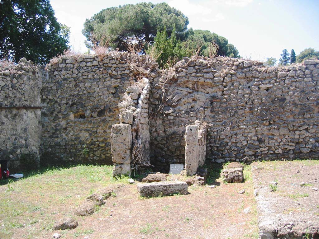 I.5.2 Pompeii. July 2008.
Looking west to south-west corner and west wall of peristyle area, showing small room with latrine. Photo courtesy of Barry Hobson.