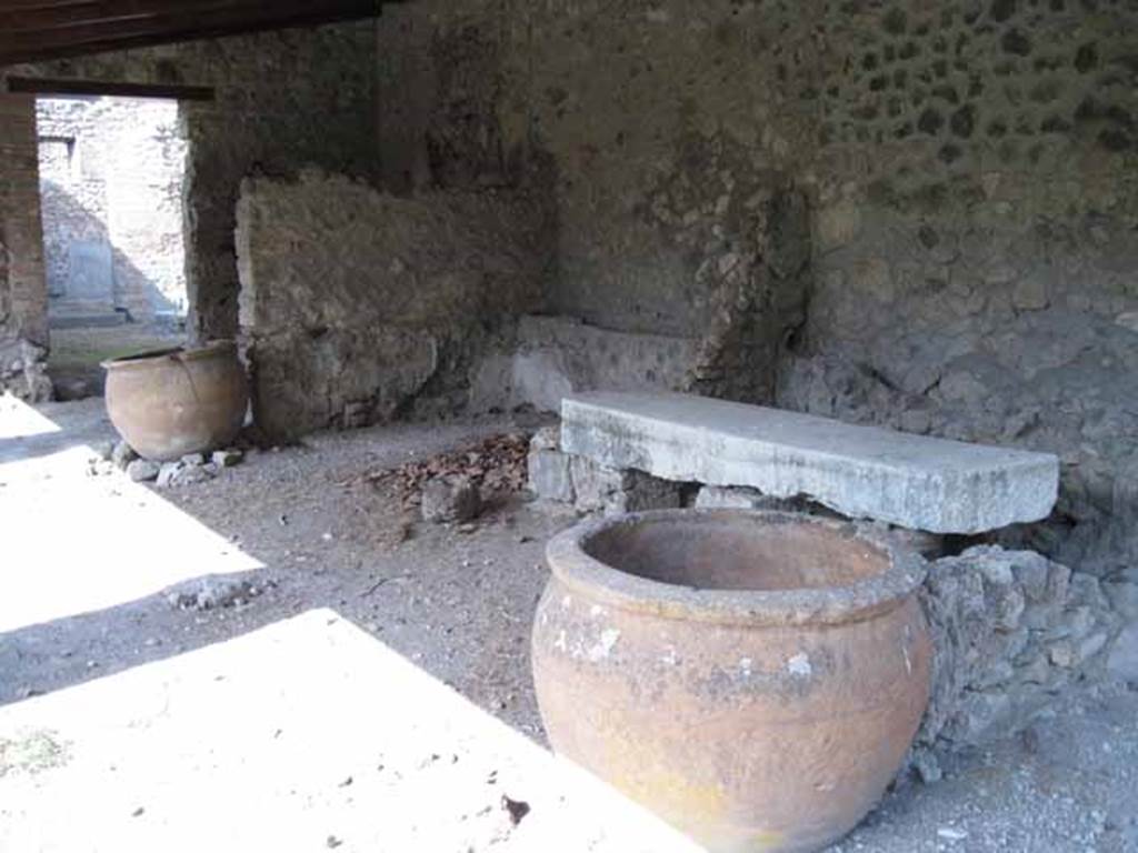 I.5.2 Pompeii. September 2010. Looking north-east across the central bay on the east portico, towards fifth and fourth (nearest the camera) divided compartments. Photo courtesy of Drew Baker.