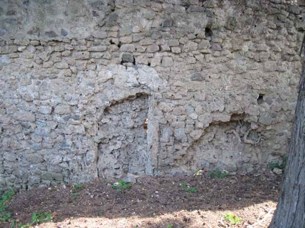 I.5.2 Pompeii. September 2010. South wall. Detail of blocked up doorway (right side of wall) leading to unnamed vicolo running between I.V and city walls looking south towards wall. Photo courtesy of Drew Baker.