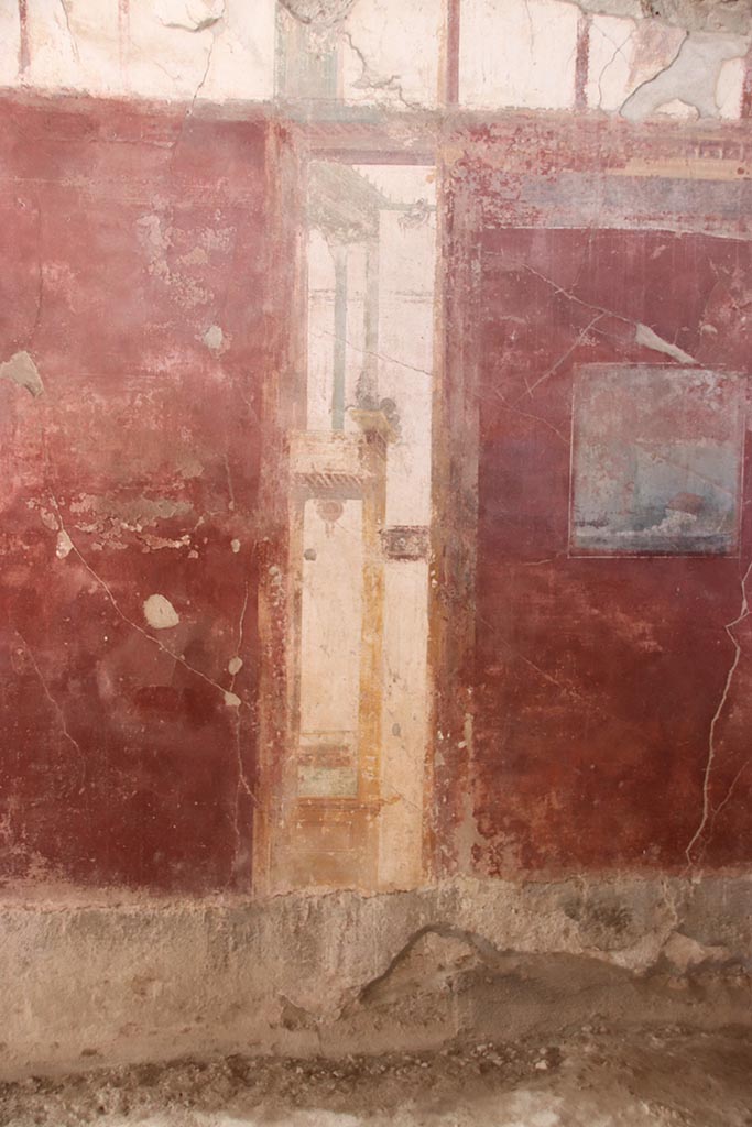 I.6.4 Pompeii. October 2024.
Room 2, west wall, detail of painted decoration on south (left) side of central painting.
Photo courtesy of Klaus Heese.