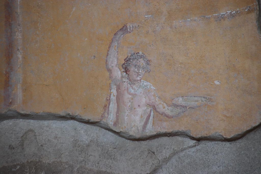 I.6.4 Pompeii. October 2022. Room 4, detail of painted figure at north end of upper east wall. Photo courtesy of Klaus Heese.