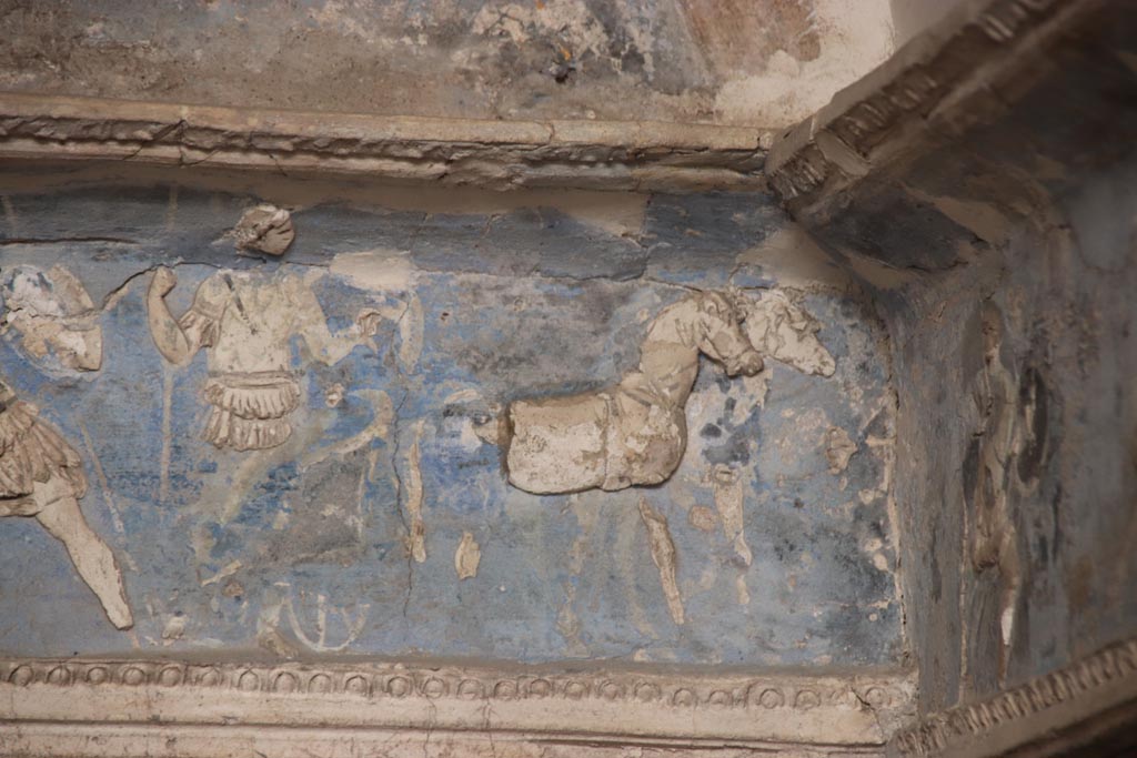 I.6.4 Pompeii. October 2023. Room 16. A chariot with two horse team and charioteer awaiting the return of Achilles.
Detail from frieze on south wall at west end. Photo courtesy of Klaus Heese.