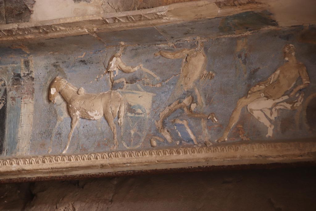 I.6.4 Pompeii. October 2023. Room 16. Priam at the feet of Achilles begs for Hector's body.
Detail from frieze on west wall towards north end of sacellum. Photo courtesy of Klaus Heese.