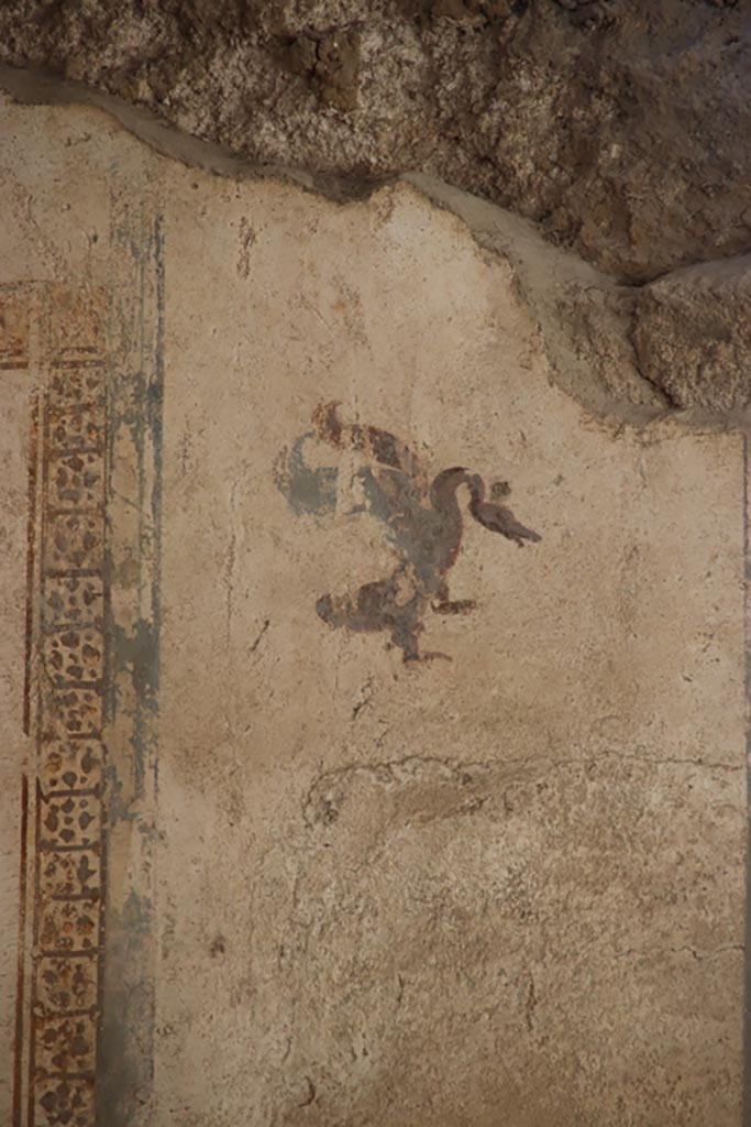 I.6.4 Pompeii. October 2022.
Room 17, detail from upper west end of north wall. Photo courtesy of Klaus Heese.