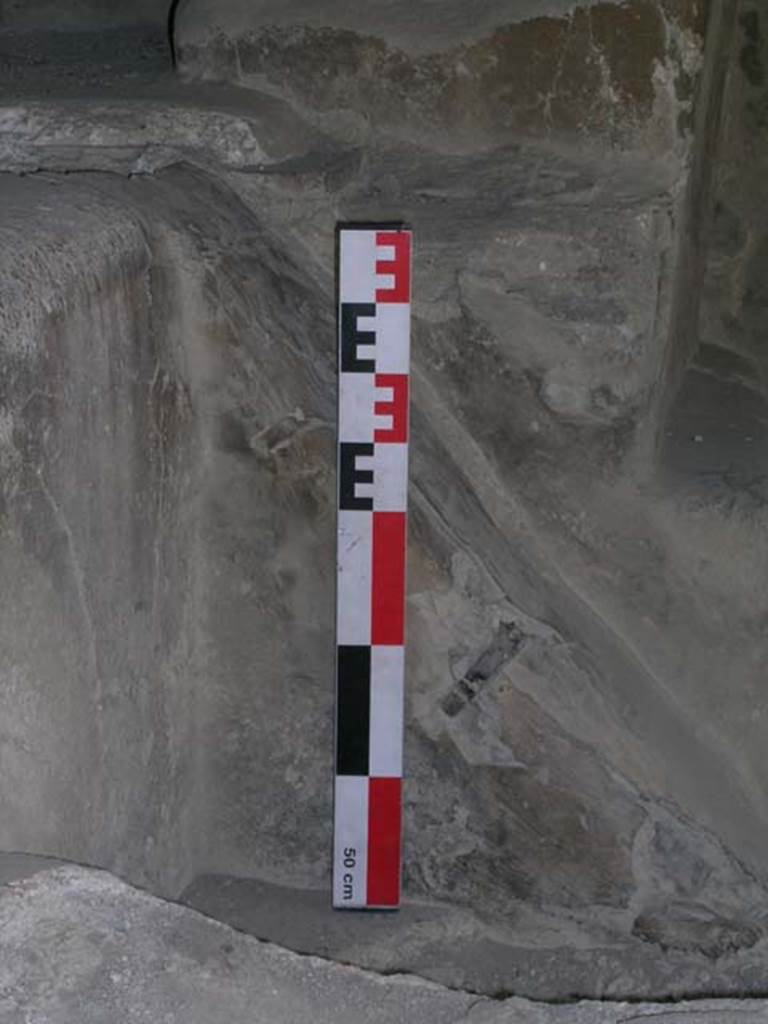 I.6.7 Pompeii. June 2006. Small triangular wall on west side of middle vat, separating basin from treading vats. Photo courtesy of Nicolas Monteix.