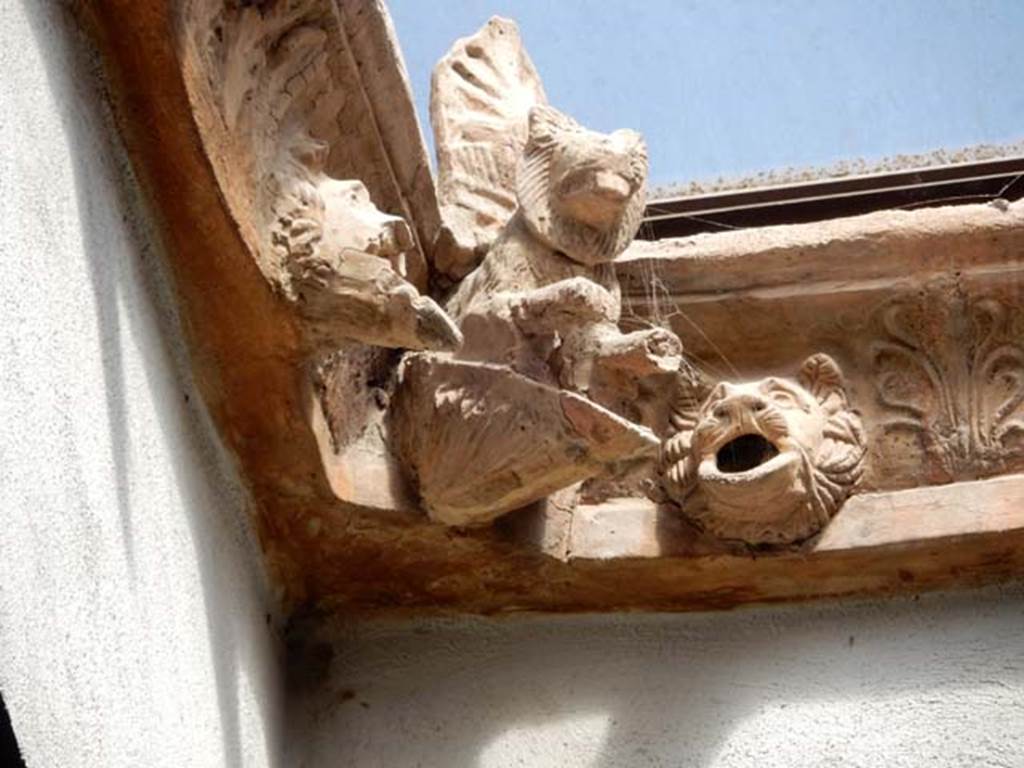 I.6.11 Pompeii. May 2015. Detail from restored compluvium, and rainwater spouts.
Photo courtesy of Buzz Ferebee.