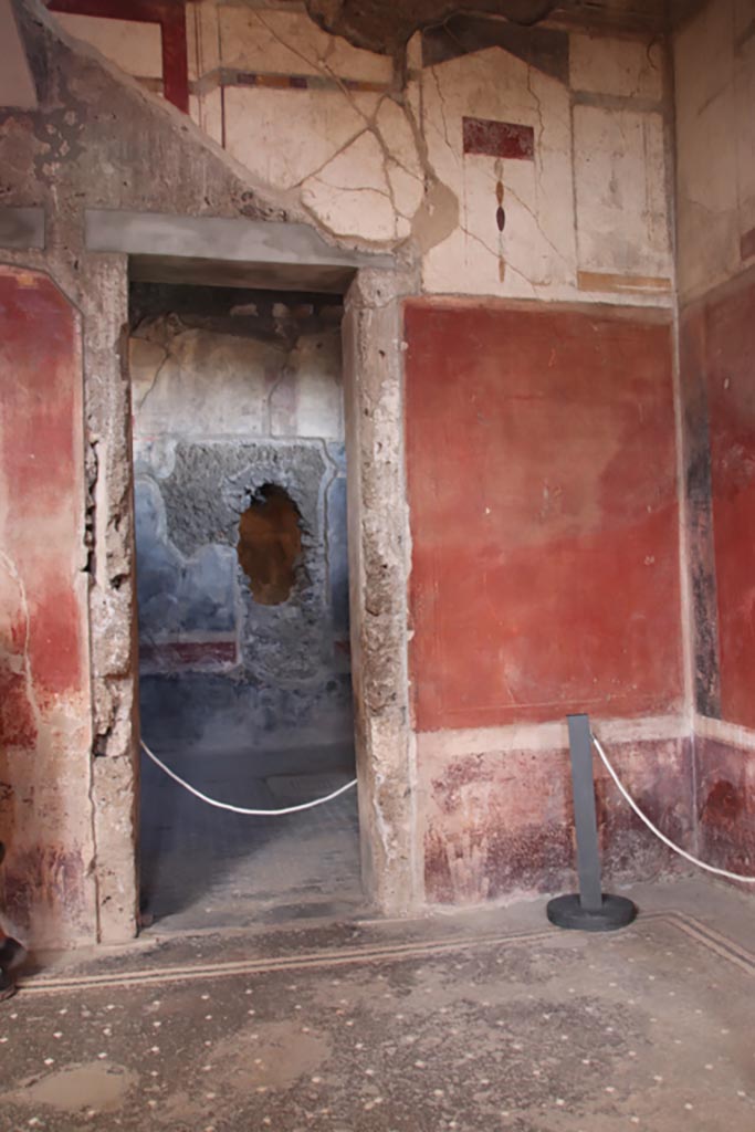 I.6.15 Pompeii. October 2023.
Room 12, triclinium, looking north through doorway in north-east corner of atrium.
Photo courtesy of Klaus Heese.