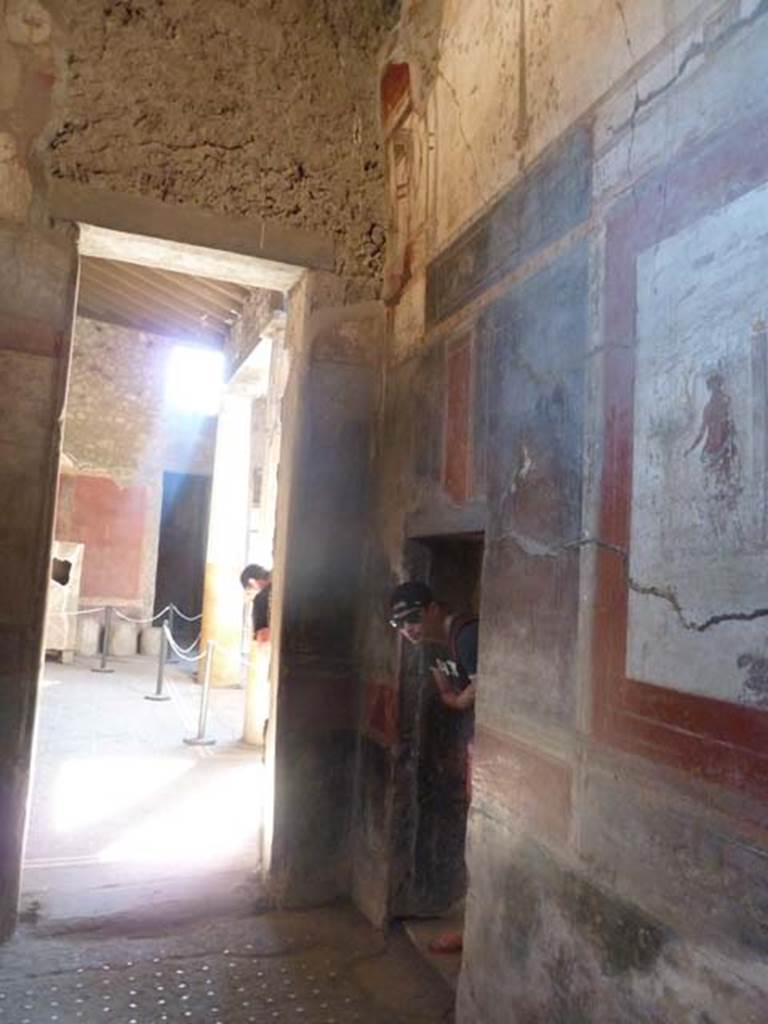 I.6.15 Pompeii. September 2015. Room 12, south-west corner with doorway to atrium in south wall, and the doorway in west wall to corridor, room 7, on right.