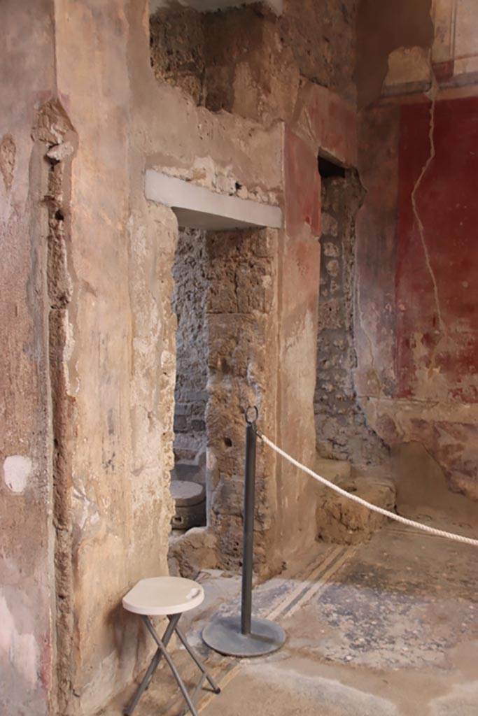 I.6.15 Pompeii. October 2023.
South-west corner of atrium, with doorway to room 1, kitchen. Photo courtesy of Klaus Heese.