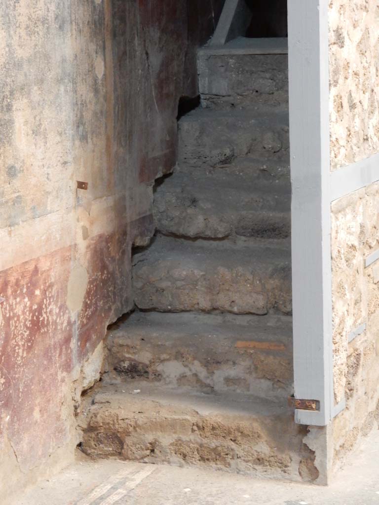 I.6.15 Pompeii. June 2019. Room 3, detail of lower stairs and reconstructed modern wooden stairs, above.
Photo courtesy of Buzz Ferebee.