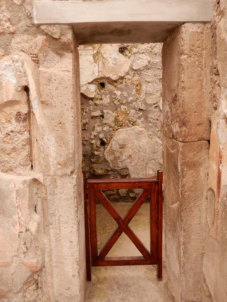 I.6.15 Pompeii. June 2019. Room 8, looking west to doorway to storeroom.
Photo courtesy of Buzz Ferebee.