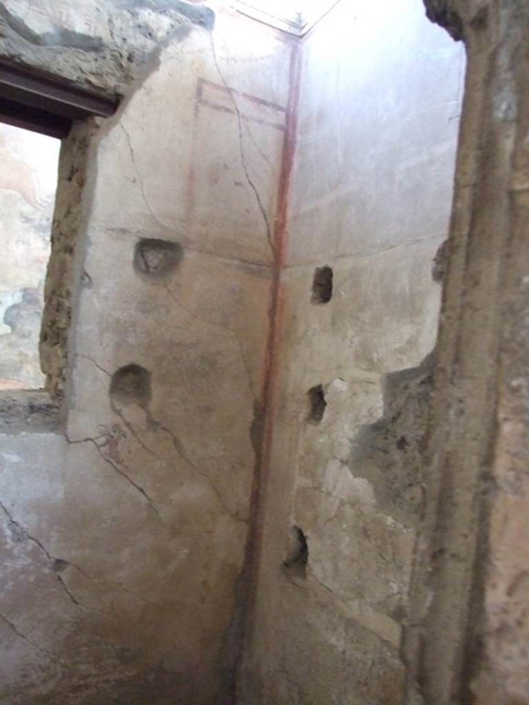 I.6.15 Pompeii. March 2009. Room 8, Storeroom. North east corner, with holes for shelving supports.