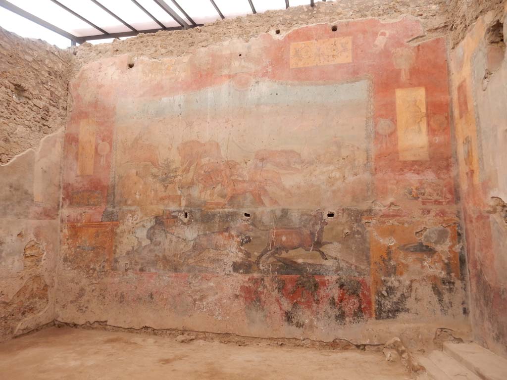 I.6.15 Pompeii. June 2019. Room 9, north wall of small garden. Painting of animal hunt scene.
Photo courtesy of Buzz Ferebee.