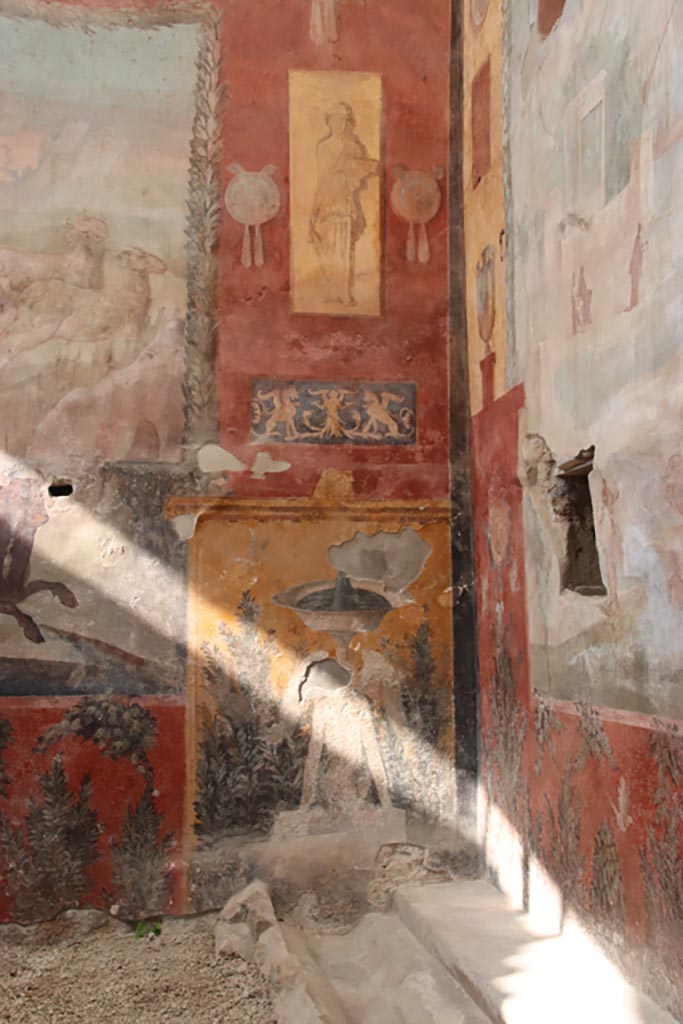 I.6.15 Pompeii. October 2023.
Room 9, detail from east end of north wall. Photo courtesy of Klaus Heese.