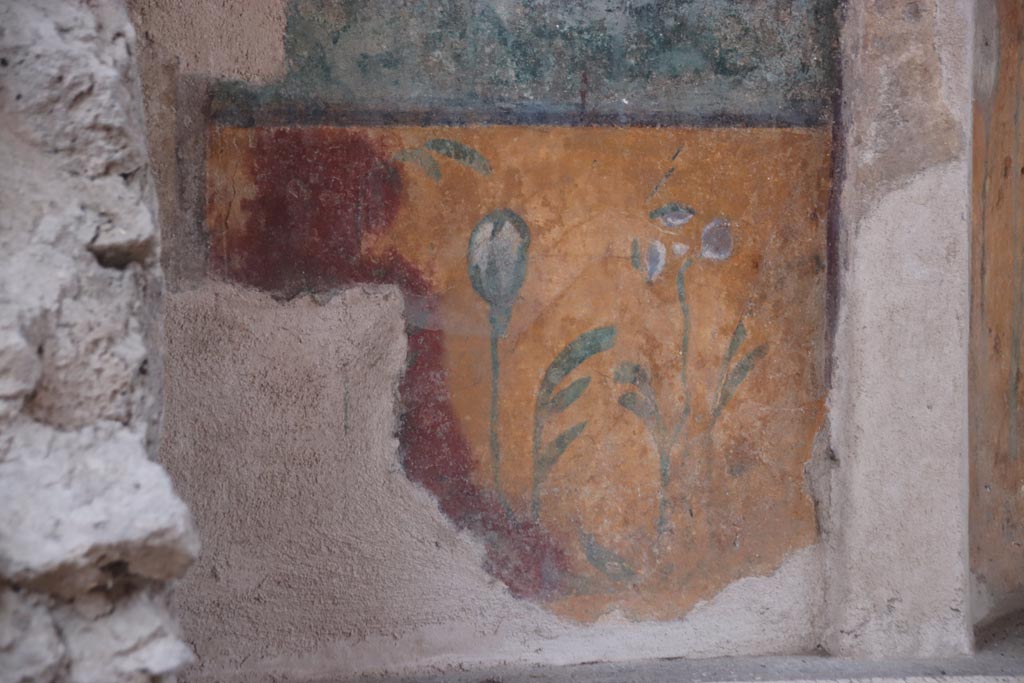 I.6.16 Pompeii. October 2022. Detail of painted panel on west side of north wall. Photo courtesy of Klaus Heese.
